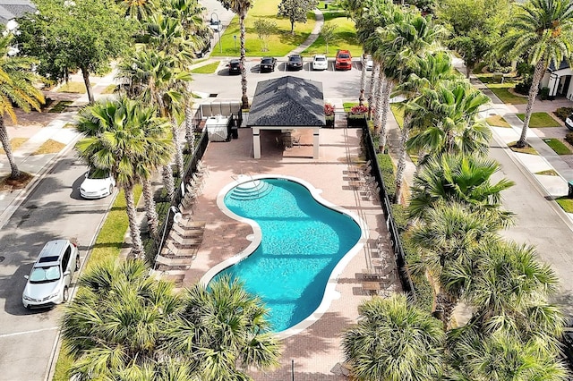 pool with fence, a gazebo, and a patio