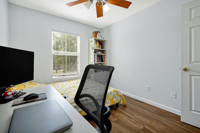 home office with ceiling fan, wood finished floors, and baseboards