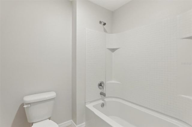 full bathroom with shower / bathtub combination, baseboards, and toilet