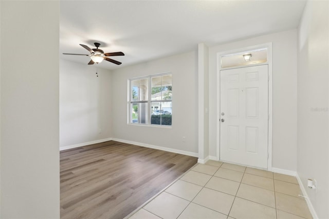 entrance foyer featuring light wood-type flooring, baseboards, and ceiling fan