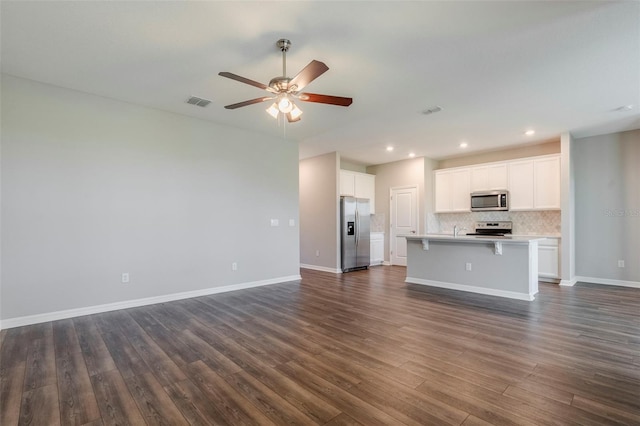 507 Daylily Blvd, Nokomis, FL 34275 - unfurnished living room featuring ceiling fan, dark wood-style flooring, baseboards, recessed lighting, and a sink