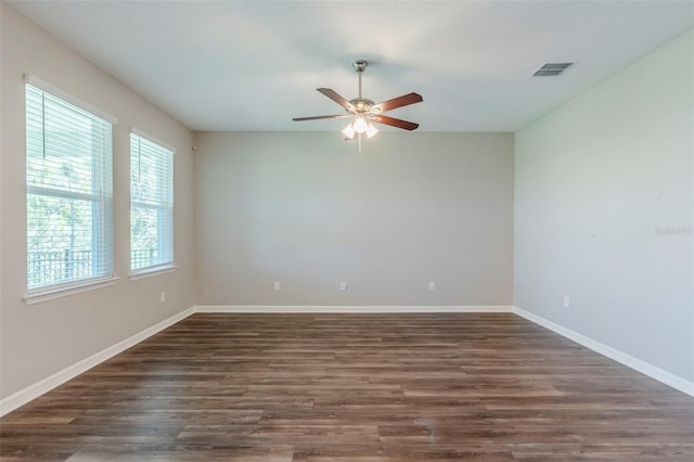 507 Daylily Blvd, Nokomis, FL 34275 - unfurnished room featuring dark wood finished floors, a ceiling fan, and baseboards