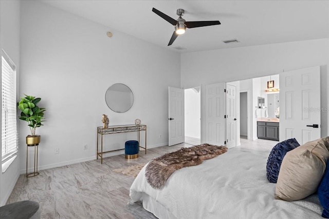 119 Argyle Gate Loop Rd, Dundee, FL 33838 - bedroom with high vaulted ceiling, baseboards, ensuite bathroom, and ceiling fan