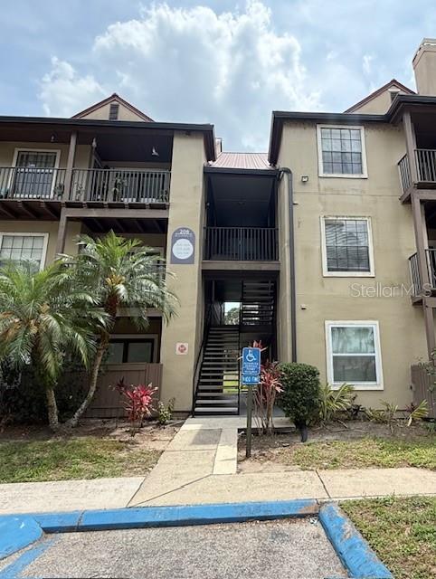 208 Afton Sq Unit 307, Altamonte Springs, FL 32714 - view of property featuring stairway