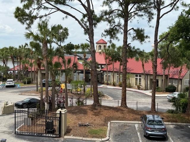 208 Afton Sq Unit 307, Altamonte Springs, FL 32714 - view of home's community with fence and uncovered parking