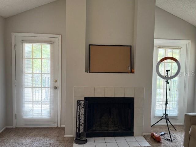 224 Afton Sq Unit 301, Altamonte Springs, FL 32714 - doorway with lofted ceiling, plenty of natural light, carpet flooring, a fireplace, and baseboards
