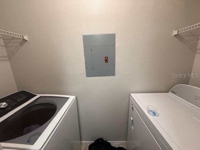 224 Afton Sq Unit 301, Altamonte Springs, FL 32714 - laundry room with electric panel and washer and clothes dryer