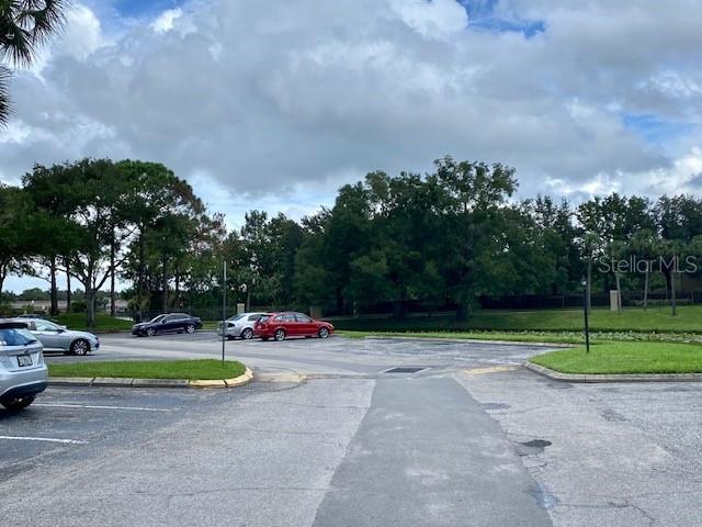 224 Afton Sq Unit 301, Altamonte Springs, FL 32714 - view of asphalt road featuring curbs