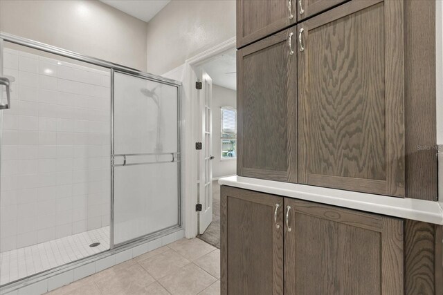 14841 Faversham Cir, Orlando, FL 32826 - bathroom with a shower stall and tile patterned flooring