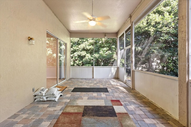14841 Faversham Cir, Orlando, FL 32826 - unfurnished sunroom with a textured wall and a textured ceiling