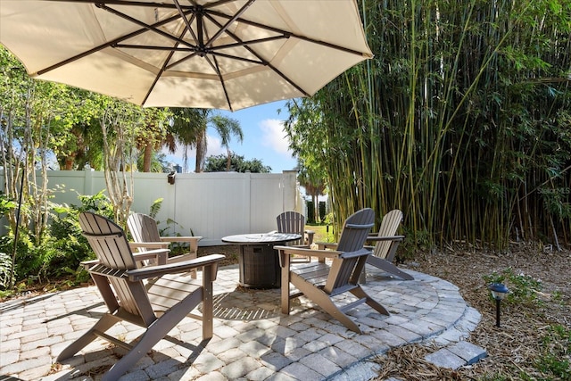 14841 Faversham Cir, Orlando, FL 32826 - view of patio with an outdoor fire pit and central AC unit