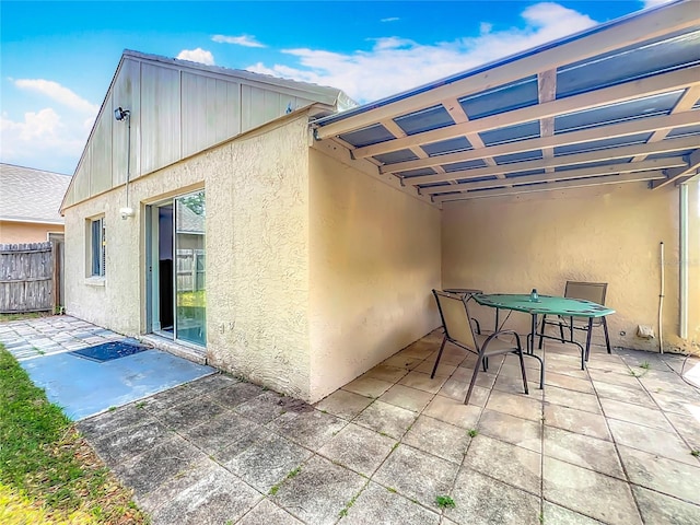view of patio / terrace featuring fence