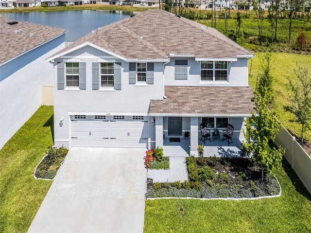1220 Tahitian Sunrise Dr, Plant City, FL 33565 - view of front of property featuring stucco siding, roof with shingles, concrete driveway, and a garage