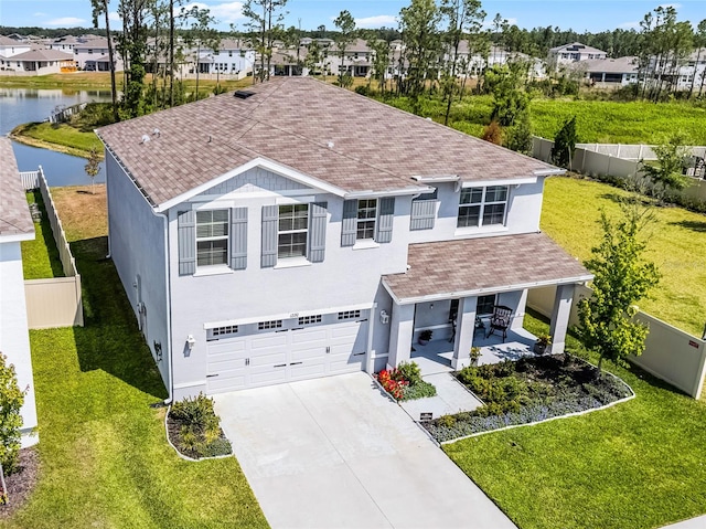 1220 Tahitian Sunrise Dr, Plant City, FL 33565 - traditional home featuring stucco siding, fence, a residential view, concrete driveway, and an attached garage