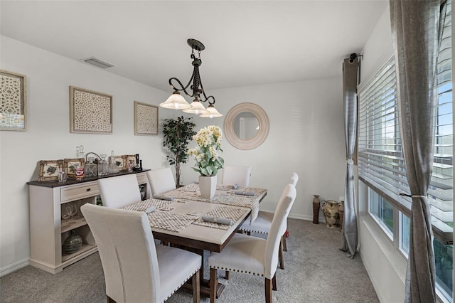 1220 Tahitian Sunrise Dr, Plant City, FL 33565 - dining space featuring baseboards, visible vents, and light carpet