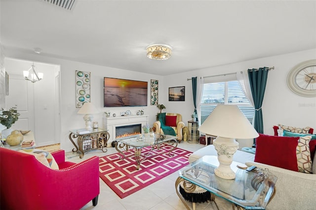 1220 Tahitian Sunrise Dr, Plant City, FL 33565 - tiled living room featuring visible vents and a glass covered fireplace