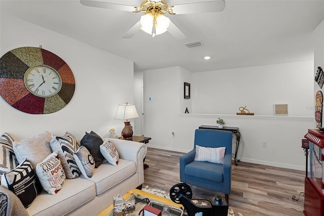 1220 Tahitian Sunrise Dr, Plant City, FL 33565 - living room with visible vents, ceiling fan, wood finished floors, and baseboards
