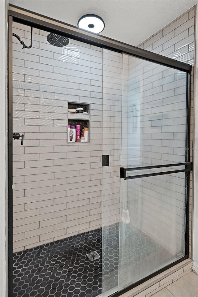 1220 Tahitian Sunrise Dr, Plant City, FL 33565 - full bath with a shower stall and tile patterned flooring