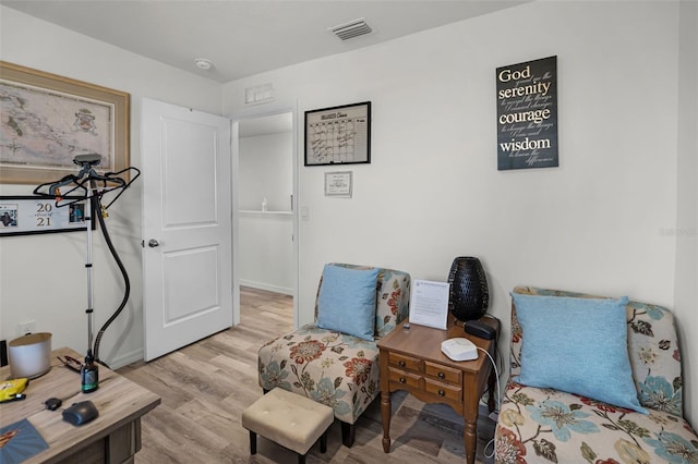 1220 Tahitian Sunrise Dr, Plant City, FL 33565 - living area with wood finished floors and visible vents