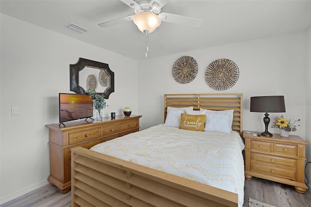 1220 Tahitian Sunrise Dr, Plant City, FL 33565 - bedroom featuring visible vents, a ceiling fan, light wood finished floors, and baseboards
