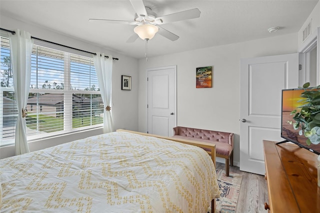 1220 Tahitian Sunrise Dr, Plant City, FL 33565 - bedroom with a ceiling fan, visible vents, and light wood-style floors