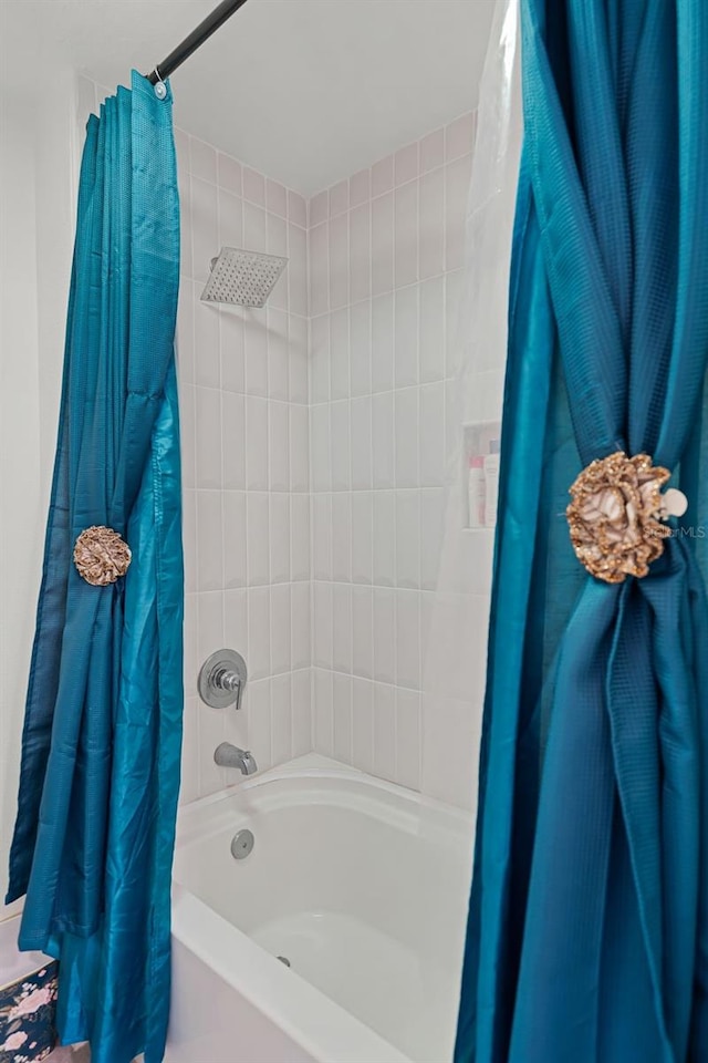 1220 Tahitian Sunrise Dr, Plant City, FL 33565 - bathroom featuring shower / bath combo with shower curtain