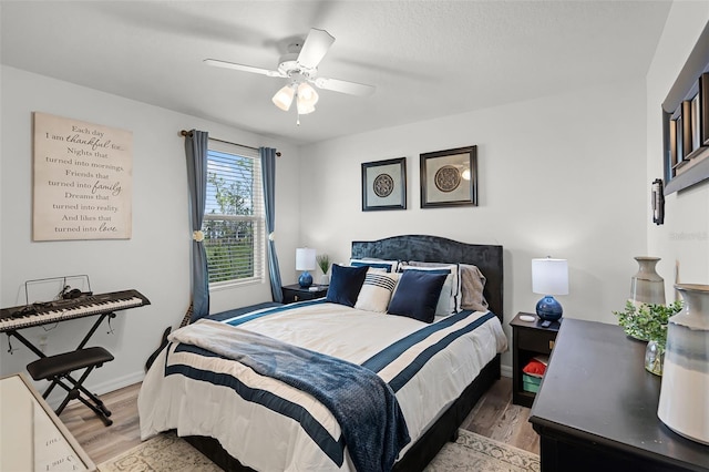 1220 Tahitian Sunrise Dr, Plant City, FL 33565 - bedroom featuring ceiling fan, light wood-style flooring, and baseboards