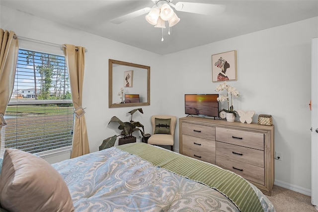 1220 Tahitian Sunrise Dr, Plant City, FL 33565 - bedroom featuring ceiling fan, light carpet, and baseboards