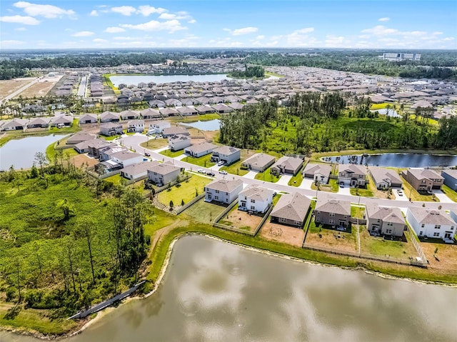 1220 Tahitian Sunrise Dr, Plant City, FL 33565 - drone / aerial view featuring a residential view and a water view