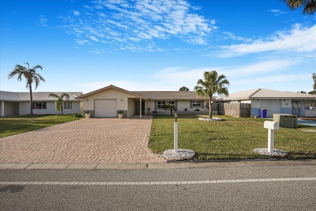 4043 Topsail Trl, New Port Richey, FL 34652 - single story home with a garage, stucco siding, a front lawn, and decorative driveway