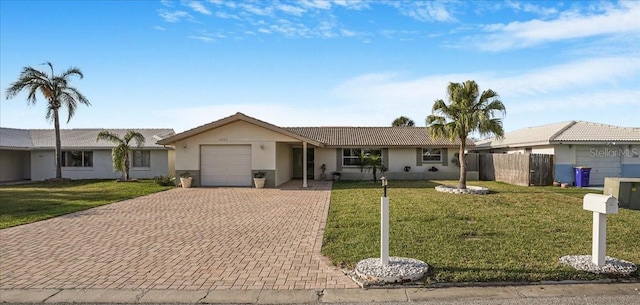 4043 Topsail Trl, New Port Richey, FL 34652 - single story home with a garage, stucco siding, decorative driveway, and a front yard