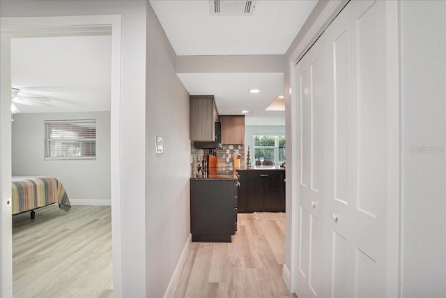 4043 Topsail Trl, New Port Richey, FL 34652 - hallway with recessed lighting, baseboards, visible vents, and light wood-style flooring