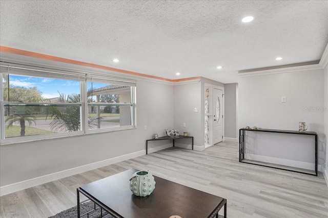 4043 Topsail Trl, New Port Richey, FL 34652 - unfurnished living room featuring crown molding, baseboards, and a textured ceiling