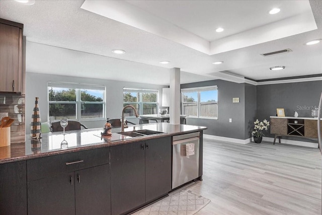 4043 Topsail Trl, New Port Richey, FL 34652 - kitchen featuring visible vents, stainless steel dishwasher, a sink, baseboards, and a tray ceiling
