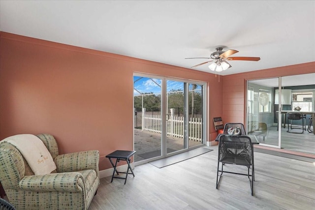 4043 Topsail Trl, New Port Richey, FL 34652 - sitting room featuring baseboards, ceiling fan, and wood finished floors