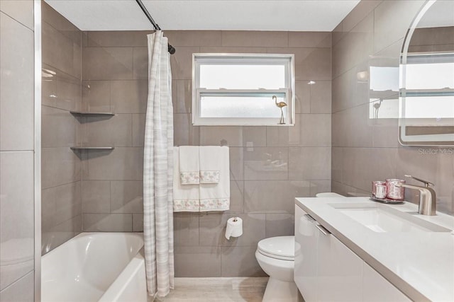 4043 Topsail Trl, New Port Richey, FL 34652 - full bath with tile walls, vanity, toilet, and shower / bath combination with curtain