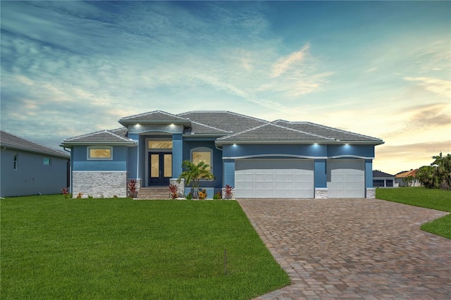 223 Rotonda Blvd S, Rotonda West, FL 33947 - view of front of property with stone siding, decorative driveway, and a front lawn