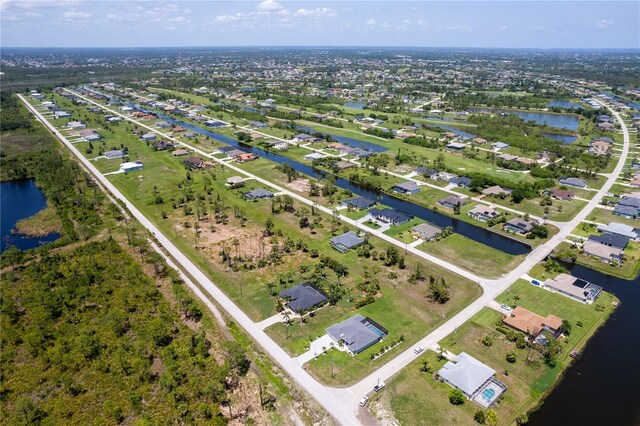 223 Rotonda Blvd S, Rotonda West, FL 33947 - aerial view of property's location with a large body of water and nearby suburban area