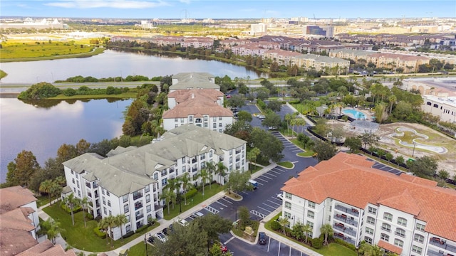 birds eye view of property with a water view