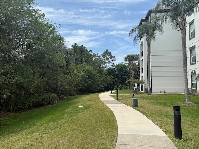 view of property's community with a lawn