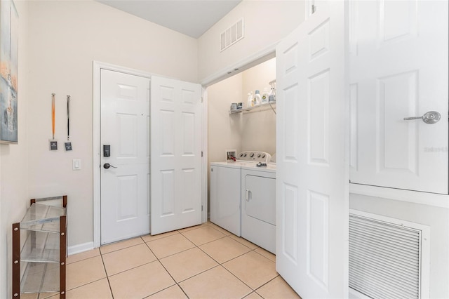 4024 Breakview Dr Unit 40604, Orlando, FL 32819 - laundry room featuring independent washer and dryer and light tile patterned floors