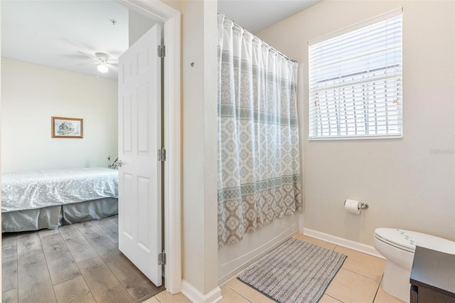 4024 Breakview Dr Unit 40604, Orlando, FL 32819 - ensuite bathroom featuring healthy amount of natural light, ceiling fan, and curtained shower