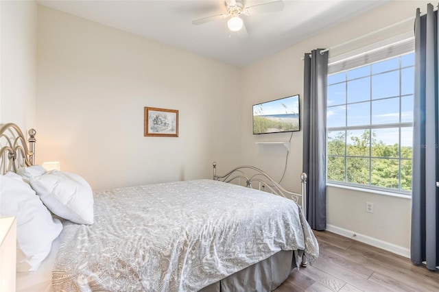 4024 Breakview Dr Unit 40604, Orlando, FL 32819 - bedroom featuring wood finished floors and a ceiling fan