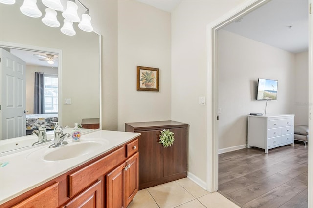 4024 Breakview Dr Unit 40604, Orlando, FL 32819 - bathroom featuring vanity, a ceiling fan, and connected bathroom