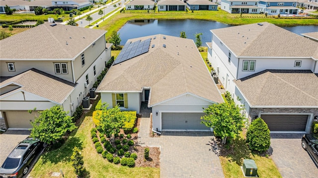 birds eye view of property featuring a residential view and a water view
