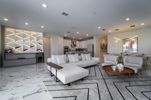 living room with recessed lighting and visible vents