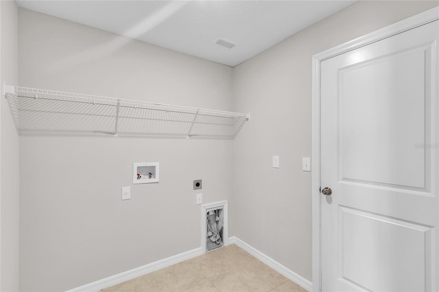 laundry area with laundry area, hookup for a washing machine, baseboards, electric dryer hookup, and visible vents