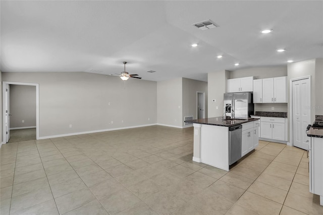 kitchen with appliances with stainless steel finishes, visible vents, ceiling fan, and lofted ceiling