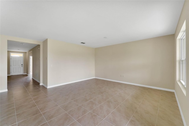tiled spare room with baseboards