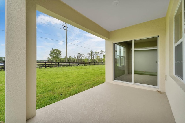 view of patio featuring fence